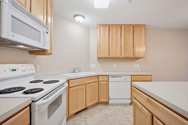 17641 69th Pl N, Maple Grove, MN 55311 - kitchen featuring white appliances, light brown cabinetry, light countertops, and a textured ceiling