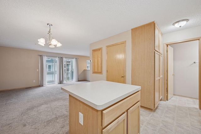 17641 69th Pl N, Maple Grove, MN 55311 - kitchen featuring a chandelier, a textured ceiling, open floor plan, a kitchen island, and pendant lighting