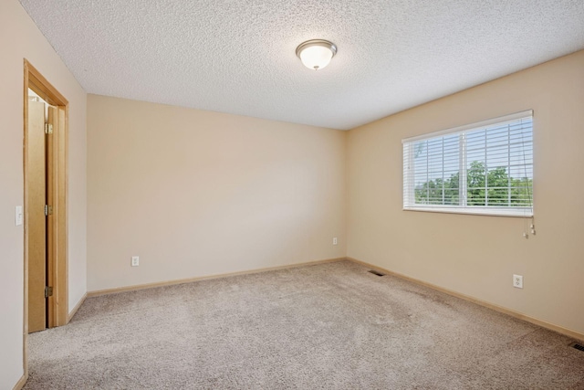 17641 69th Pl N, Maple Grove, MN 55311 - carpeted spare room featuring a textured ceiling