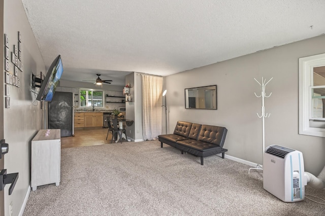 800-802 Parkview Ln, Champlin, MN 55316 - sitting room featuring light colored carpet, ceiling fan, and a textured ceiling