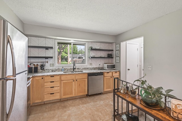 800-802 Parkview Ln, Champlin, MN 55316 - kitchen featuring stainless steel appliances, open shelves, a textured ceiling, tasteful backsplash, and light stone counters