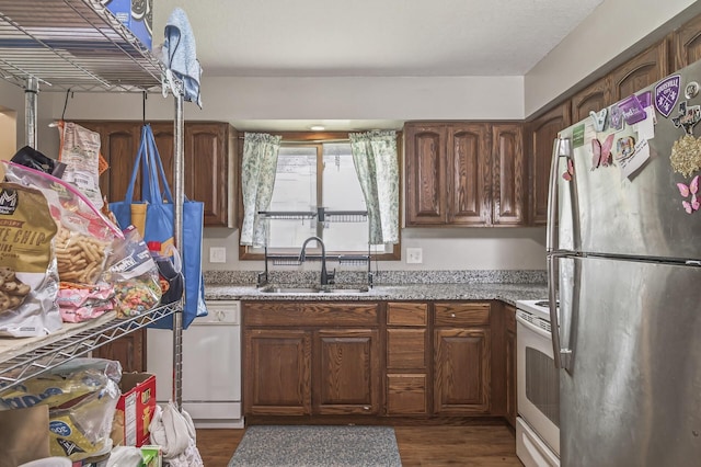 800-802 Parkview Ln, Champlin, MN 55316 - kitchen featuring freestanding refrigerator, white electric stove, light stone counters, and dark wood finished floors