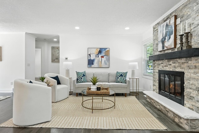 2638 Florida Ave S, Saint Louis Park, MN 55426 - living area with crown molding, wood finished floors, a fireplace, a textured ceiling, and recessed lighting