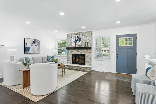 2638 Florida Ave S, Saint Louis Park, MN 55426 - living room with hardwood / wood-style floors, a fireplace, ornamental molding, and recessed lighting