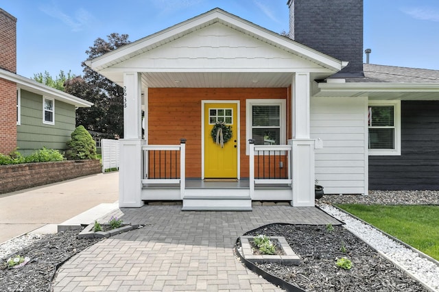 2638 Florida Ave S, Saint Louis Park, MN 55426 - doorway to property featuring covered porch and a chimney