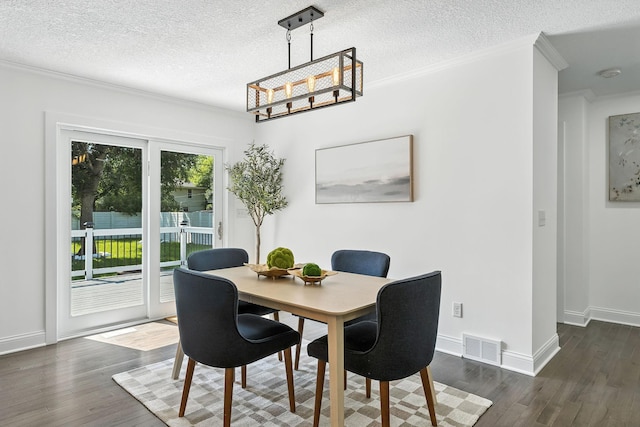 2638 Florida Ave S, Saint Louis Park, MN 55426 - dining space with ornamental molding, dark wood finished floors, a textured ceiling, and a chandelier