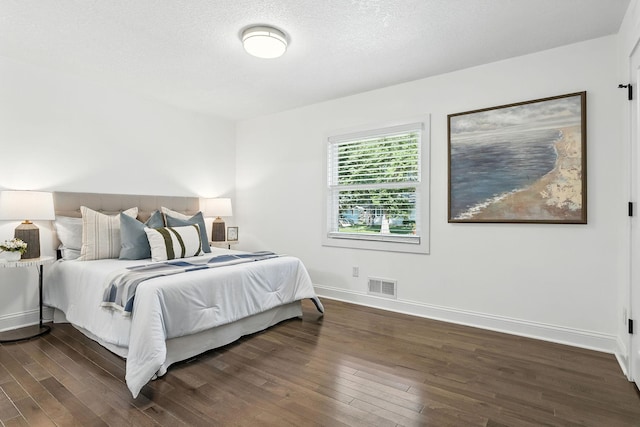 2638 Florida Ave S, Saint Louis Park, MN 55426 - bedroom featuring dark wood finished floors and a textured ceiling