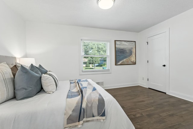 2638 Florida Ave S, Saint Louis Park, MN 55426 - bedroom featuring dark wood-style flooring and baseboards