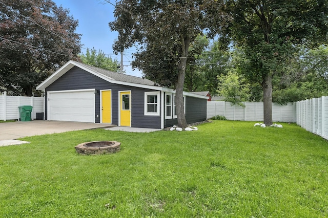 2638 Florida Ave S, Saint Louis Park, MN 55426 - view of front of house featuring a fenced backyard, a detached garage, and a fire pit