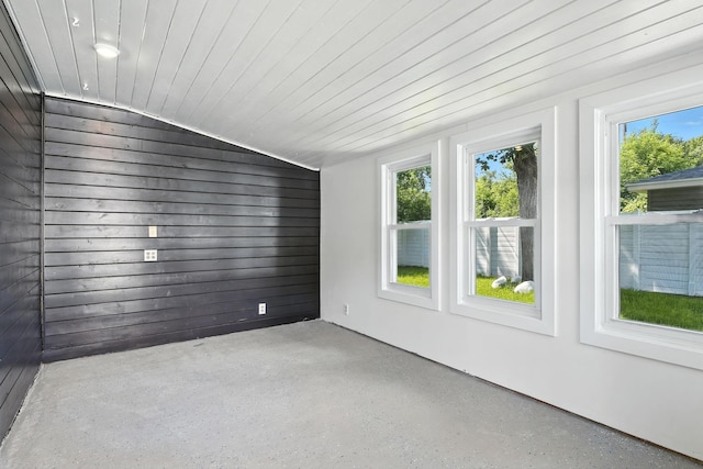 2638 Florida Ave S, Saint Louis Park, MN 55426 - empty room featuring plenty of natural light, vaulted ceiling, and speckled floor