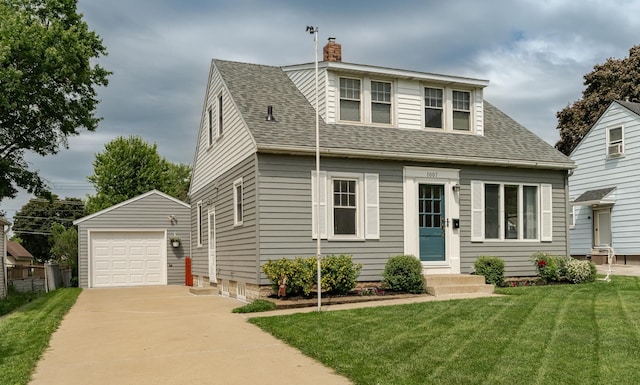 1007 12th Ave NE, Rochester, MN 55906 - view of front facade with an outbuilding, a detached garage, concrete driveway, and a shingled roof