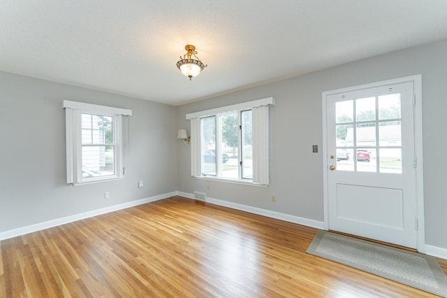 1007 12th Ave NE, Rochester, MN 55906 - interior space featuring light wood-style flooring and baseboards