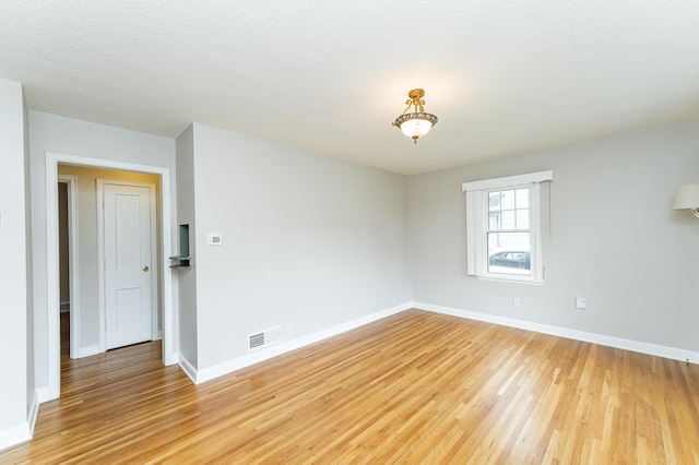 1007 12th Ave NE, Rochester, MN 55906 - spare room with light wood-style flooring