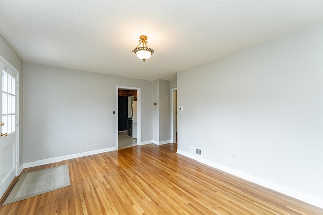 1007 12th Ave NE, Rochester, MN 55906 - unfurnished room featuring light wood-style flooring and baseboards