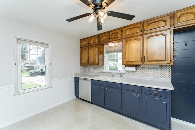 1007 12th Ave NE, Rochester, MN 55906 - kitchen with stainless steel dishwasher, healthy amount of natural light, light countertops, wainscoting, and ceiling fan