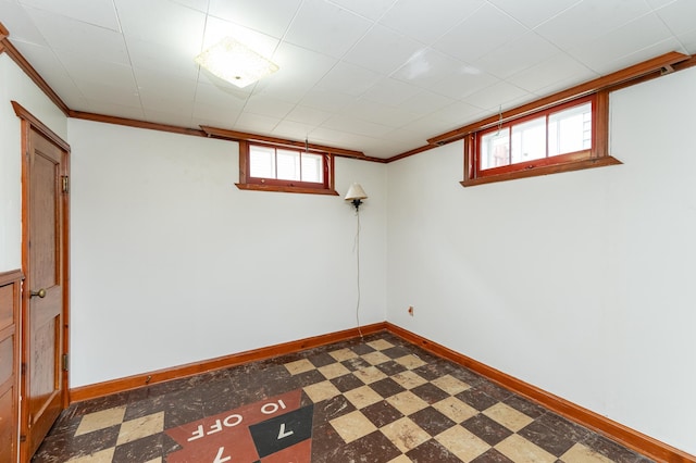 1007 12th Ave NE, Rochester, MN 55906 - basement with ornamental molding and tile patterned floors