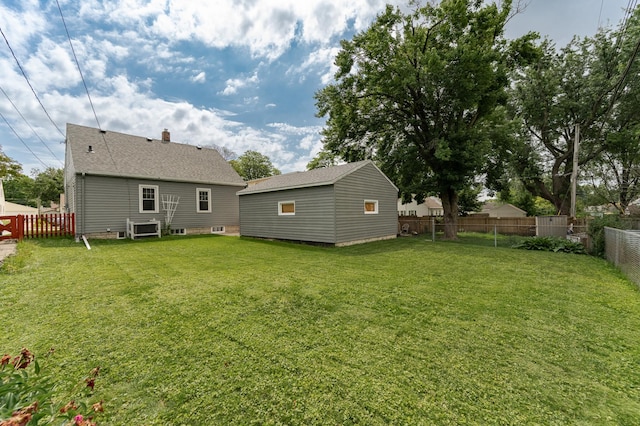 1007 12th Ave NE, Rochester, MN 55906 - back of property with a fenced backyard and an outbuilding