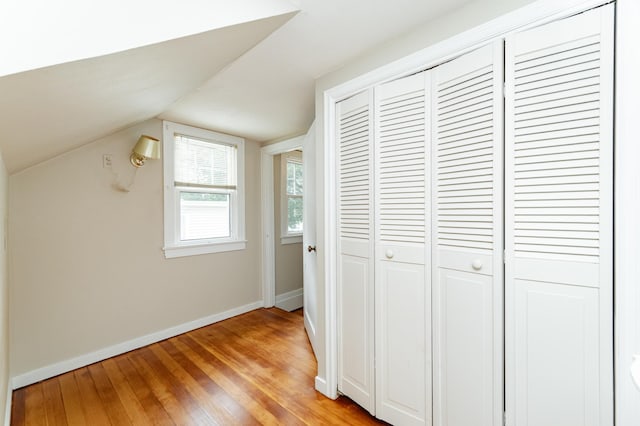1007 12th Ave NE, Rochester, MN 55906 - bonus room with light wood-style floors and vaulted ceiling