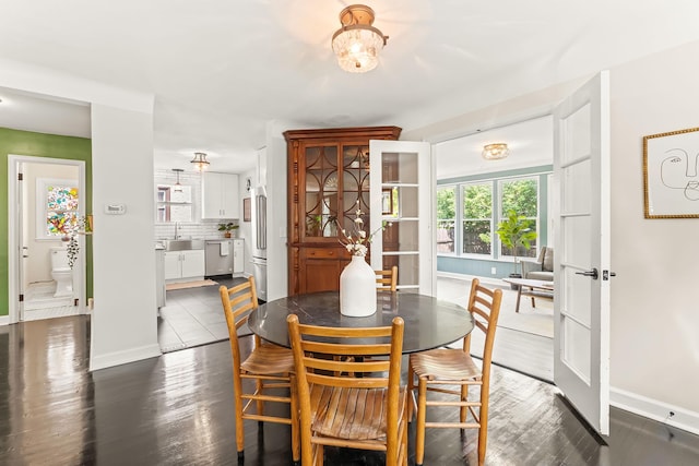 3615 33rd Ave S, Minneapolis, MN 55406 - dining room featuring baseboards and dark wood finished floors