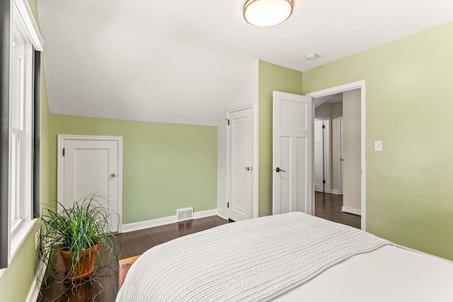 3615 33rd Ave S, Minneapolis, MN 55406 - bedroom with dark wood finished floors, a closet, and lofted ceiling