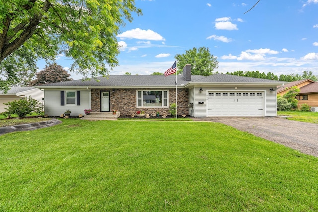 854 Fairfield Rd, New Richmond, WI 54017 - ranch-style house with asphalt driveway, a garage, a chimney, and a front lawn
