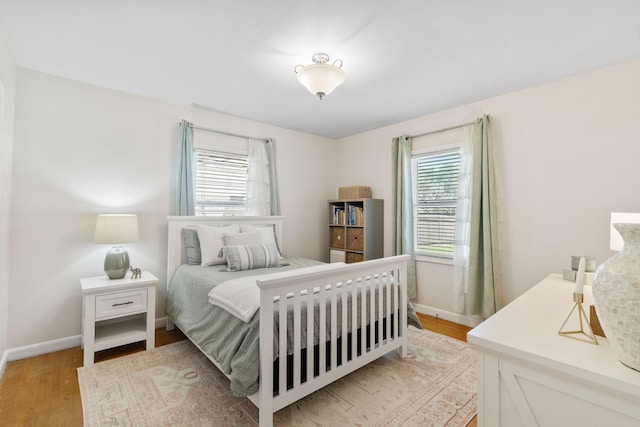 854 Fairfield Rd, New Richmond, WI 54017 - bedroom with light wood-type flooring and baseboards