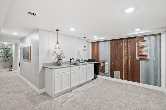 854 Fairfield Rd, New Richmond, WI 54017 - kitchen with light carpet, decorative light fixtures, white cabinetry, dishwasher, and light countertops