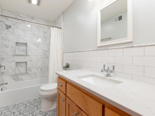 68749 195th St, Darwin, MN 55324 - bathroom with vanity, shower / tub combo with curtain, tile patterned floors, and tile walls