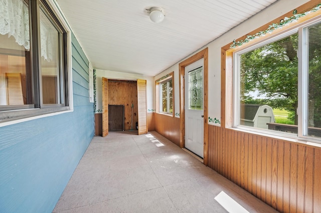 3070 County Rd E, Springfield Twp, WI 54013 - unfurnished sunroom with wooden walls