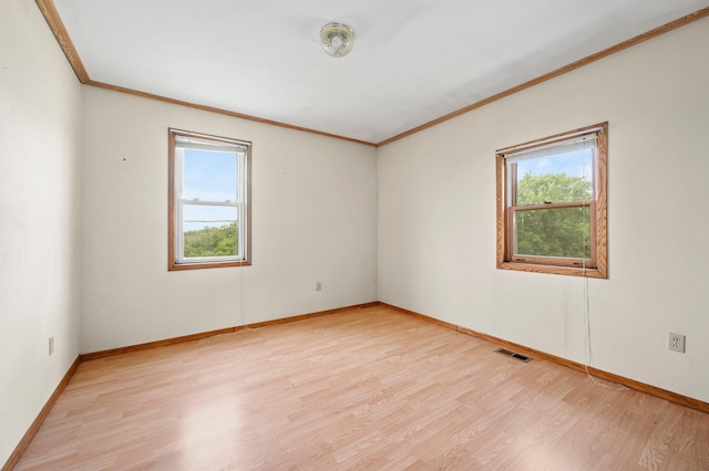 3070 County Rd E, Springfield Twp, WI 54013 - empty room with ornamental molding and light wood-style flooring