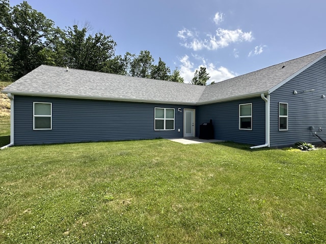 1817 Ridgewood Cir, Menomonie, WI 54751 - rear view of property with a yard and a shingled roof