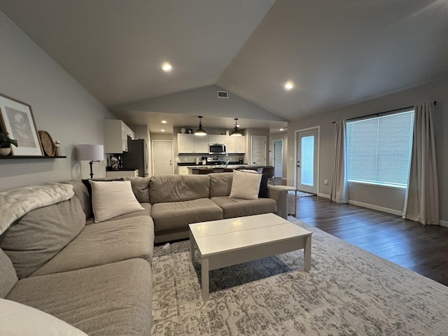 1817 Ridgewood Cir, Menomonie, WI 54751 - living room with dark wood-type flooring, vaulted ceiling, and recessed lighting