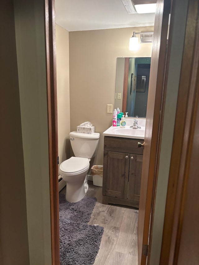 9151 Breezy Point Dr Unit 424, Pequot Lakes, MN 56472 - half bathroom featuring vanity and wood finished floors
