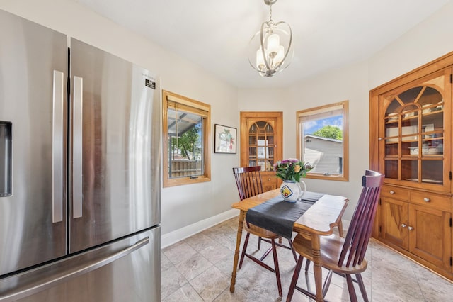 4105 31st Ave S, Minneapolis, MN 55406 - dining space featuring healthy amount of natural light, a chandelier, and light tile patterned floors