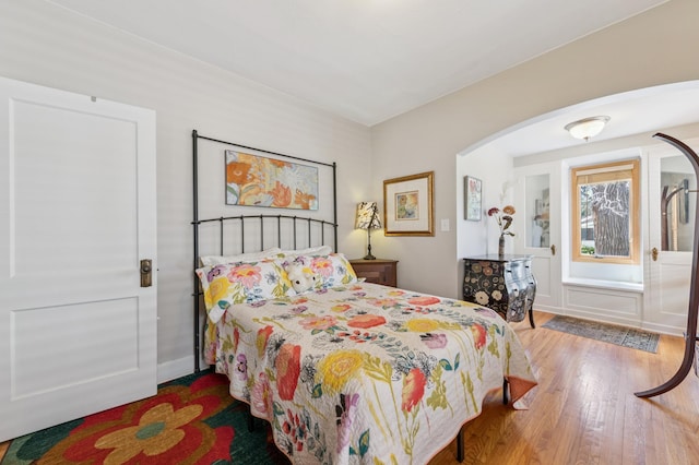 4105 31st Ave S, Minneapolis, MN 55406 - bedroom with wood finished floors and arched walkways