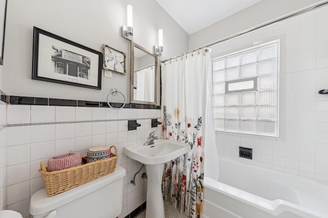 4105 31st Ave S, Minneapolis, MN 55406 - bathroom featuring tile walls, shower / tub combo with curtain, and plenty of natural light