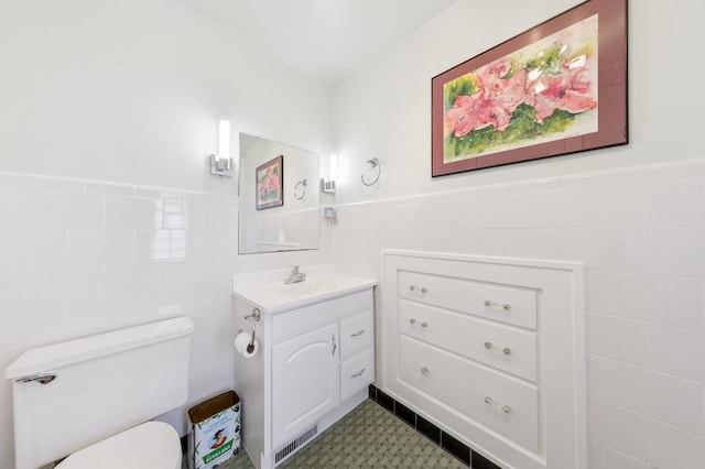 4105 31st Ave S, Minneapolis, MN 55406 - bathroom featuring tile walls, vanity, and wainscoting
