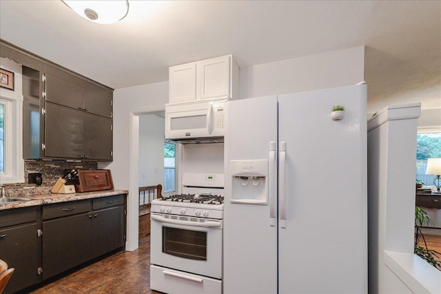 5220 Jersey Ave N, Crystal, MN 55428 - kitchen featuring white appliances, backsplash, and light countertops