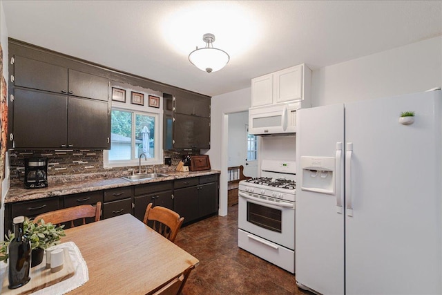 5220 Jersey Ave N, Crystal, MN 55428 - kitchen featuring white appliances, tasteful backsplash, concrete flooring, and white cabinets