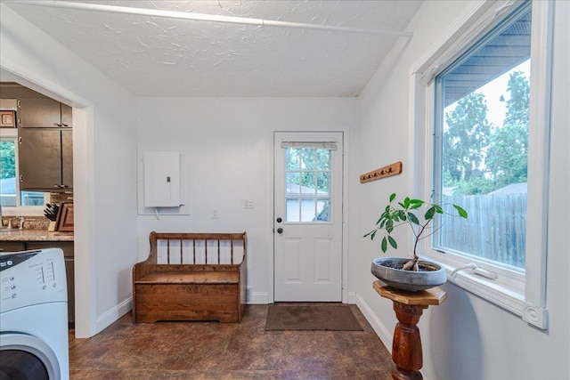 5220 Jersey Ave N, Crystal, MN 55428 - entrance foyer with washer / clothes dryer, electric panel, and a textured ceiling