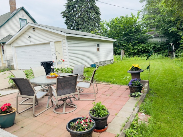 371 Sherburne Ave, Saint Paul, MN 55103 - view of patio / terrace with outdoor dining area, a garage, and an outbuilding