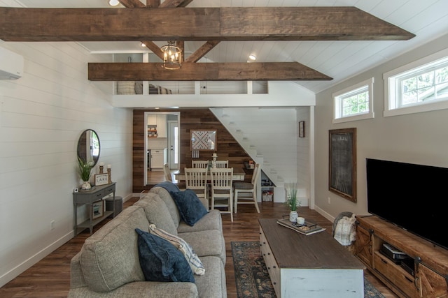 21865 512th Ln, Mcgregor, MN 55760 - living room with wood walls, stairway, dark wood-style floors, a wall mounted air conditioner, and a chandelier