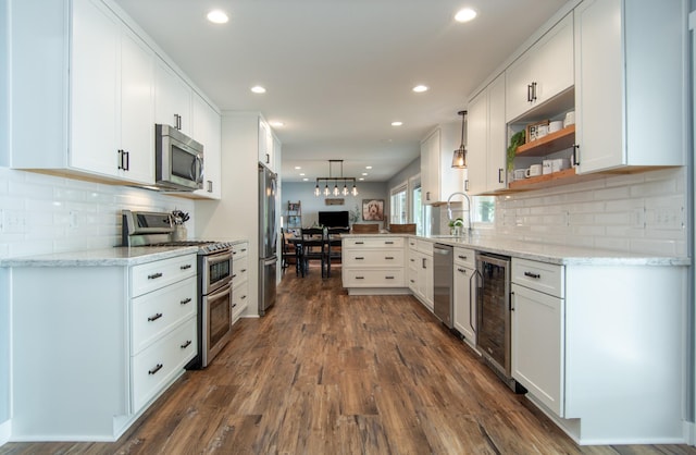 21865 512th Ln, Mcgregor, MN 55760 - kitchen with appliances with stainless steel finishes, wine cooler, white cabinetry, light stone countertops, and recessed lighting