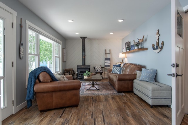 21865 512th Ln, Mcgregor, MN 55760 - living area with wood finished floors, a wood stove, wood walls, and recessed lighting