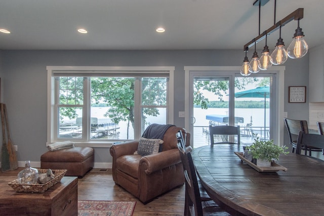 21865 512th Ln, Mcgregor, MN 55760 - dining space featuring plenty of natural light, wood finished floors, recessed lighting, and a chandelier