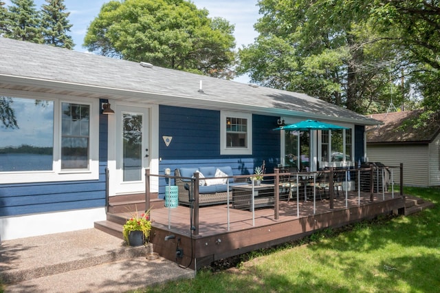 21865 512th Ln, Mcgregor, MN 55760 - back of property with outdoor lounge area, a wooden deck, a yard, and roof with shingles
