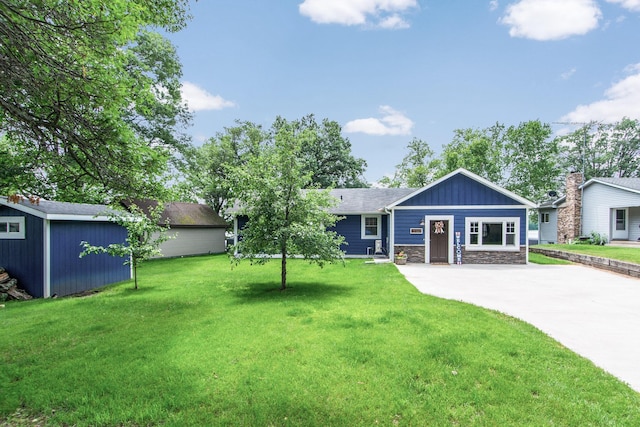 21865 512th Ln, Mcgregor, MN 55760 - view of front of house featuring stone siding, a front yard, a shed, driveway, and board and batten siding