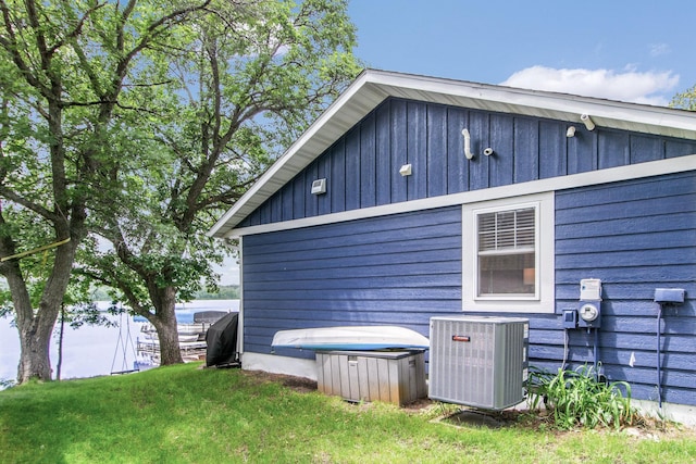 21865 512th Ln, Mcgregor, MN 55760 - view of side of home featuring a central AC unit and board and batten siding