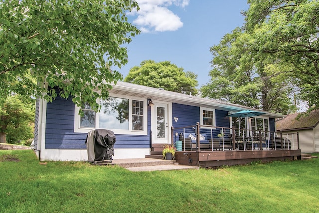21865 512th Ln, Mcgregor, MN 55760 - back of property with a yard and a wooden deck
