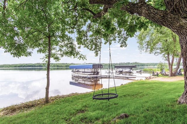 21865 512th Ln, Mcgregor, MN 55760 - view of community featuring a water view, a boat dock, and a yard